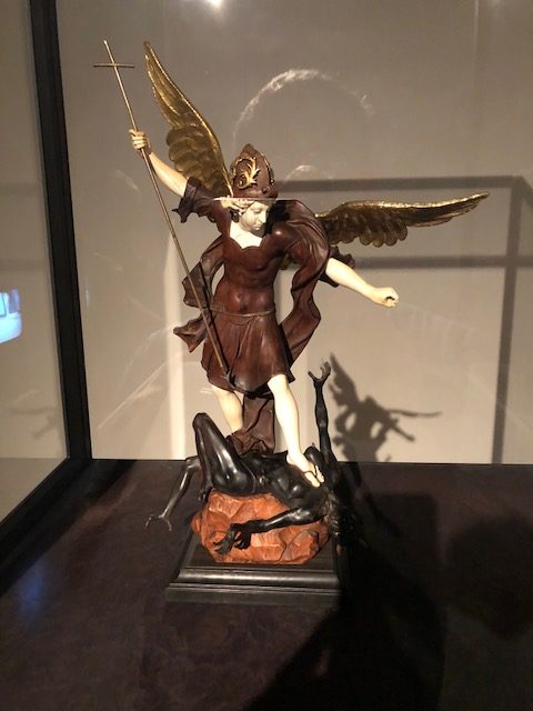 The archangel St. Michael battling a demon. Artist is Simon Troger, made in Munich around 1725, of walnut, ebony, ivory, glass and copper