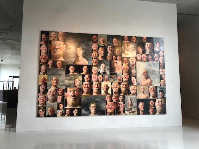 91 faces in this painting according to the description. I didn't verify that but feel free! 
