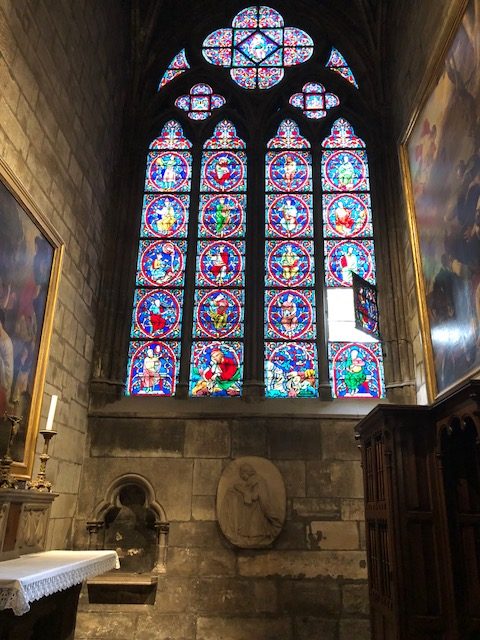 Stained glass window, with one of the panels opened inward 