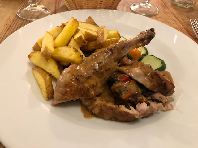 Rabbit stuffed with mixed vegetables, and french fries 