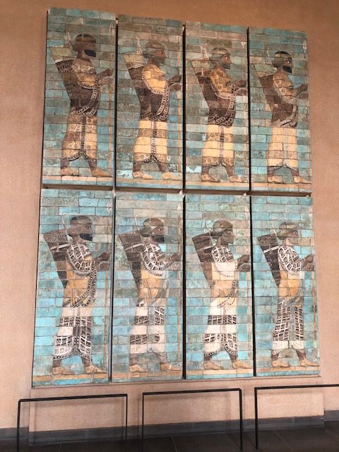 Eight frames of ancient tiles depicting - hunters again? Looks like it. 