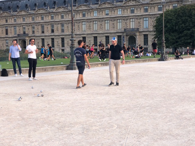 People enjoying the area around the Louvre
