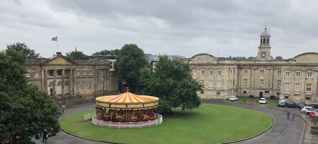 York Castle Museum on the left, and a carousel in front of it 