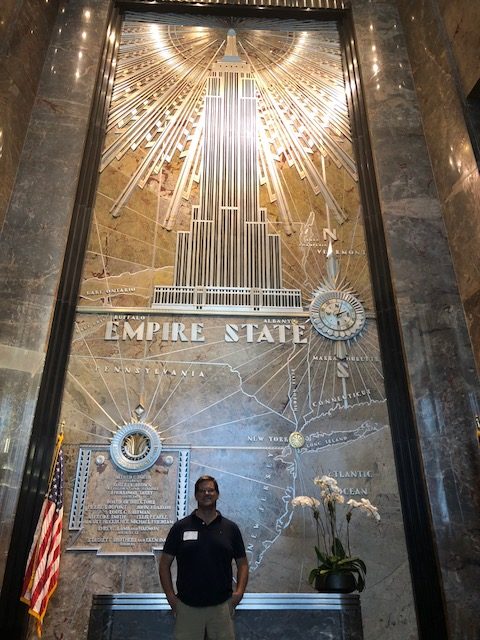 A beautiful art deco piece of Empire State Building in the lobby 