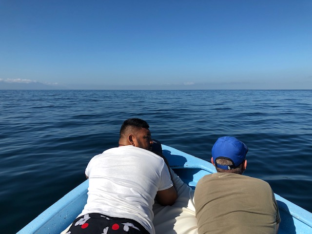 Juan and Christopher relaxing on the front of the boat