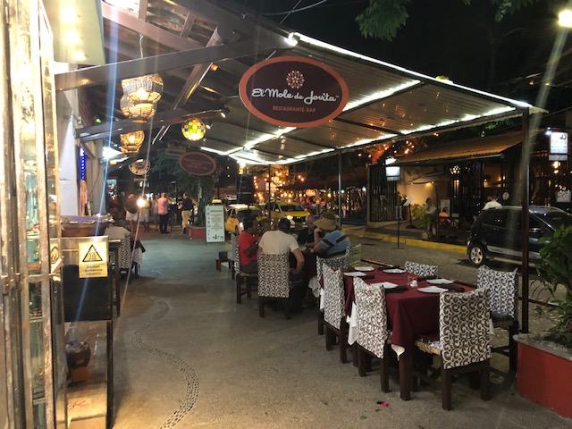 El Mole de Jovita - mole restaurant, photo of the restaurnt sign over the sidewalk and outdoor seating