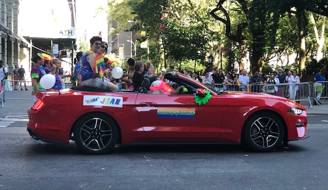 A red convertible with this sign: Mama Jean, Founder of Gay Pride March
