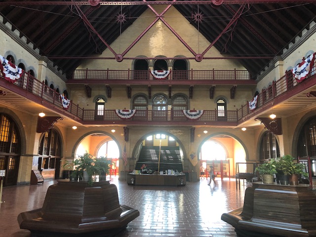 Inside the train station. Big room open to the second level with a balcony along the perimeter