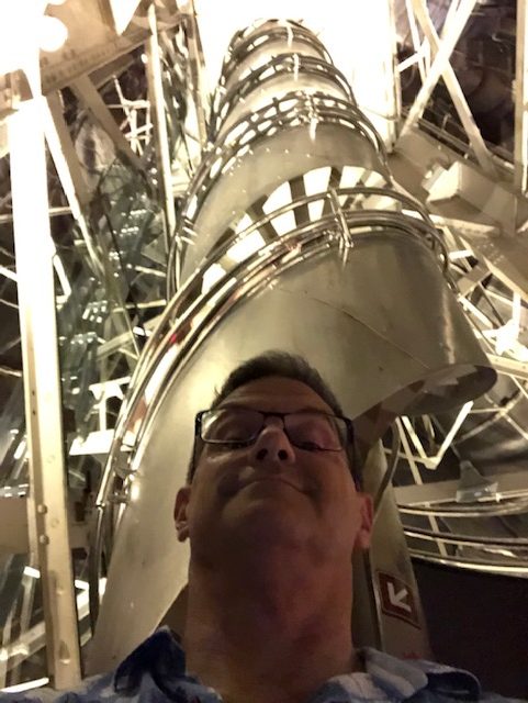 A selfie with the steel spiral staircase going up over my head