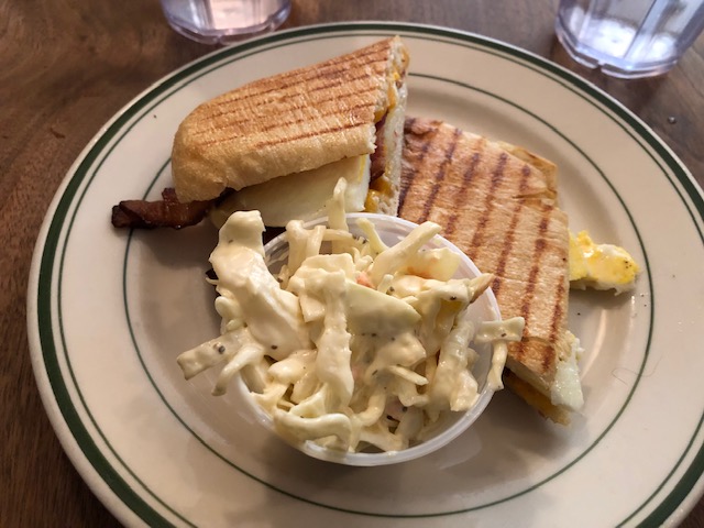 A sandwich and cole slaw