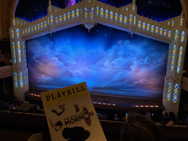 Book of Mormon stage with the Playbill snuck in bottom left