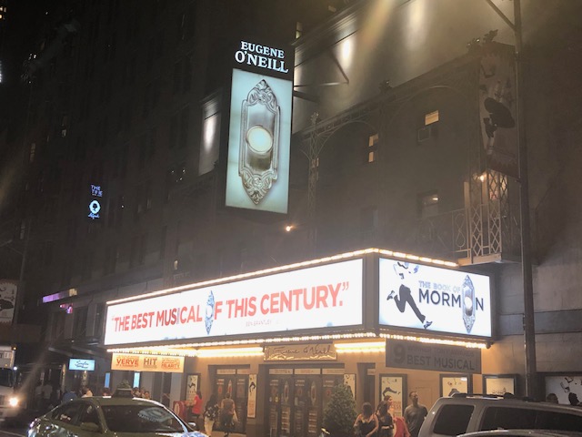 Book of Mormon marquee claiming "The Best Musical of the Century" on the long side of it, taken from across the street