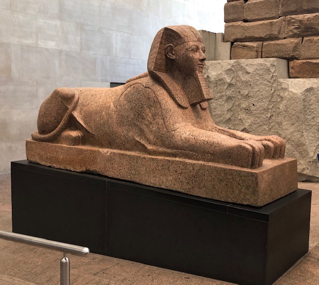 A small sphinx, about 12 feet long, maybe as high including the base