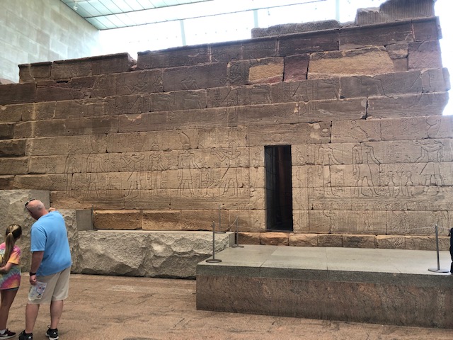 A closeup shot of the temple from the side, covered in hieroglyphics
