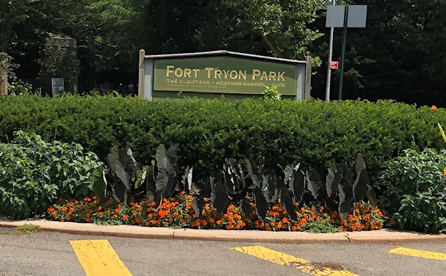 Sign in a garden which is in the middle of a roundabout