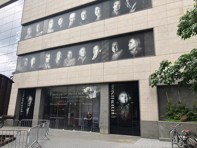 Entrance to the museum - two rows of black and white photos, each maybe 2x3 feet, above the doors, 9 per row