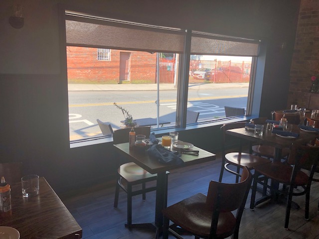 Inside the restaurant, table by window looking out onto the street