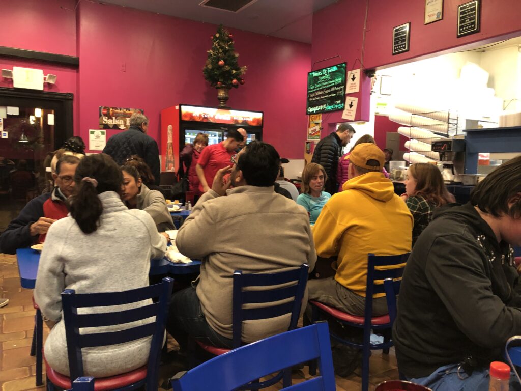 inside of the restaurant showing ever table full