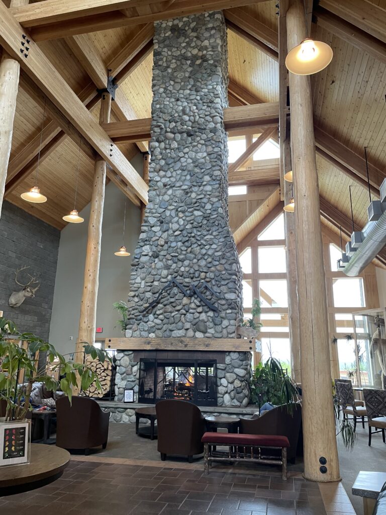 A stone fireplace of massive height in the center of the lobby, maybe 3 stories high. And it's literal center, not center wall. 
