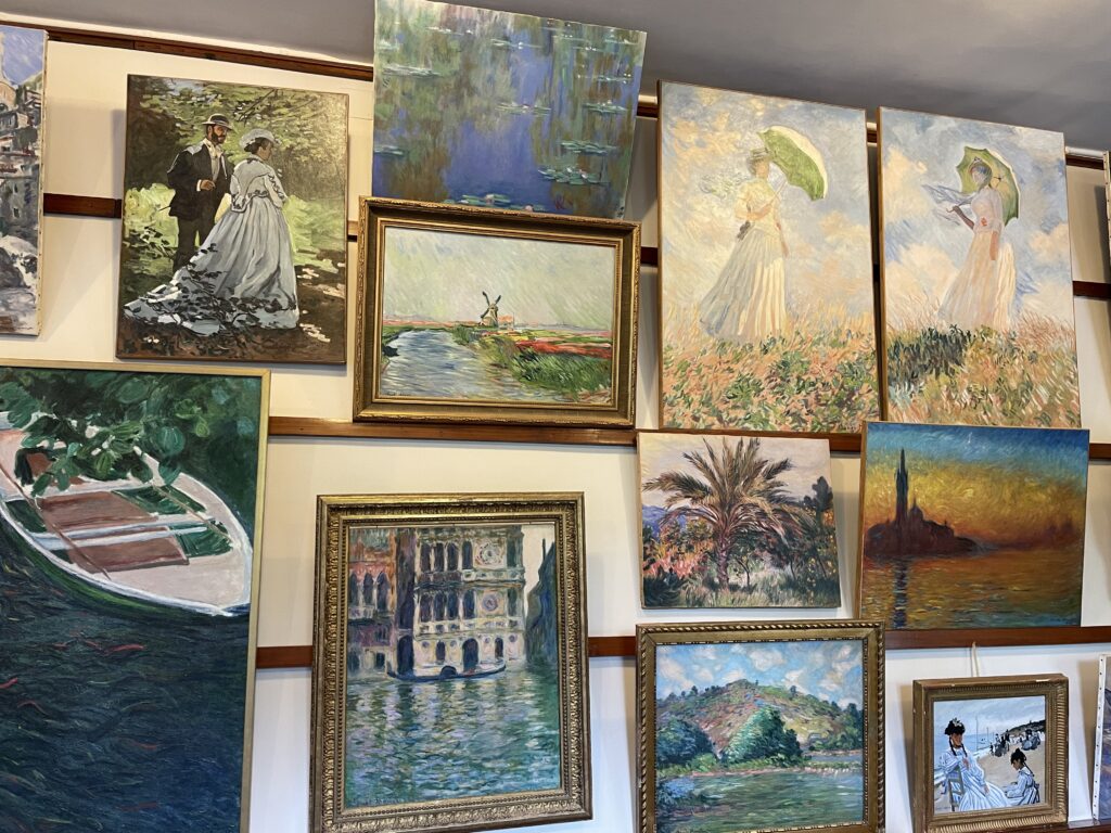 A wall full of his paintings. 