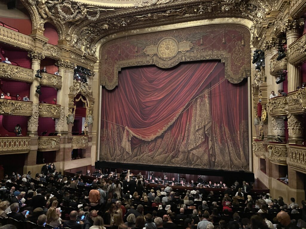 The stage with red curtain, gilded walls showing 4 layers of balconies. 